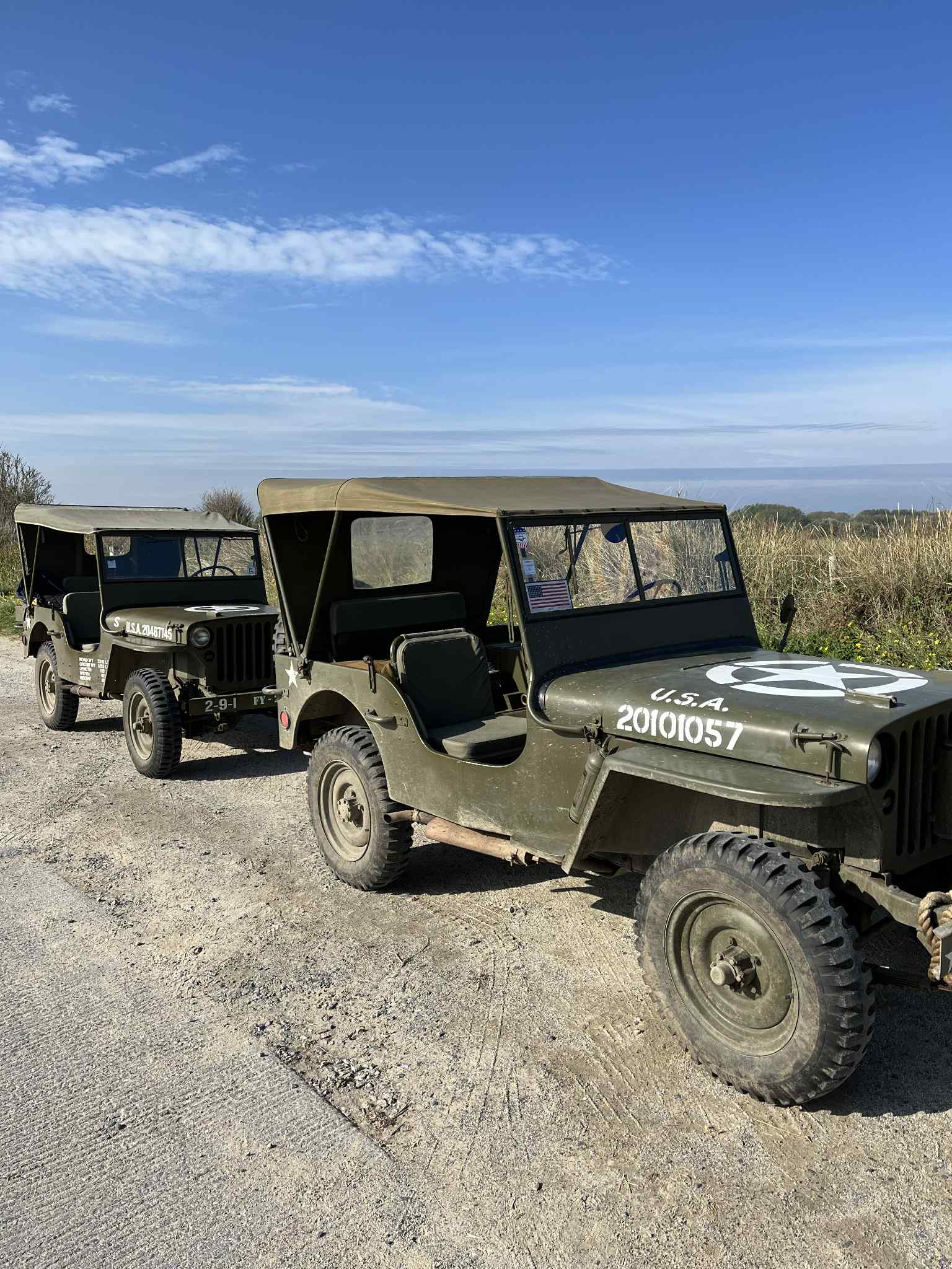 Two Jeeps waiting for their passengers near